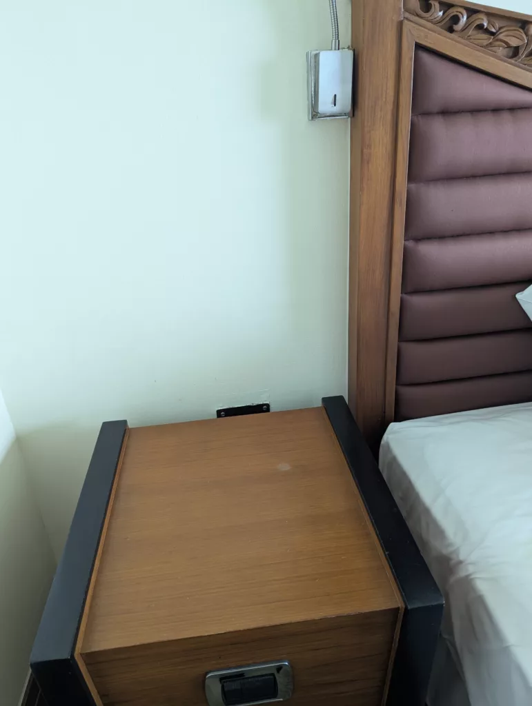 Bedside with no outlets at all.